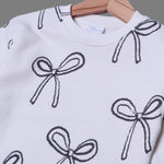 Load image into Gallery viewer, WHITE WITH BLACK &quot;BOW&quot; PRINTED TERRY FABRIC SWEATSHIRT
