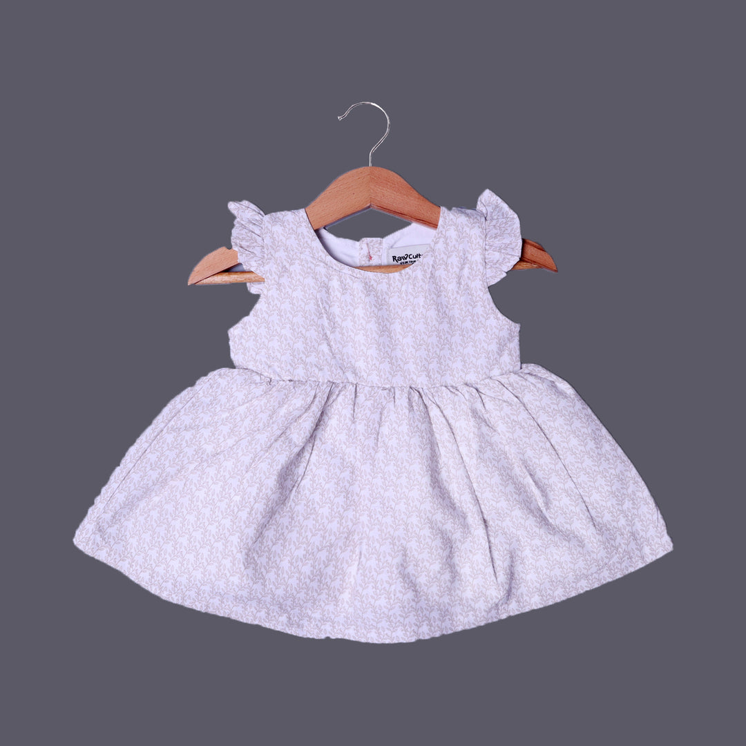CREAM LEAVES PRINTED FRIL SLEEVES COTTON FABRIC FROCK FOR GIRLS