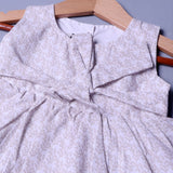 CREAM LEAVES PRINTED FRIL SLEEVES LESS COTTON FABRIC FROCK FOR GIRLS