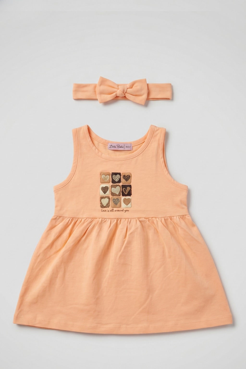 Peach Hearts Print With Hair Band Frock For Girls Main image